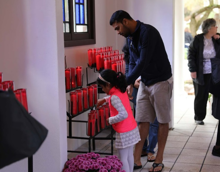 lighting candles at the Holy Family Shrine